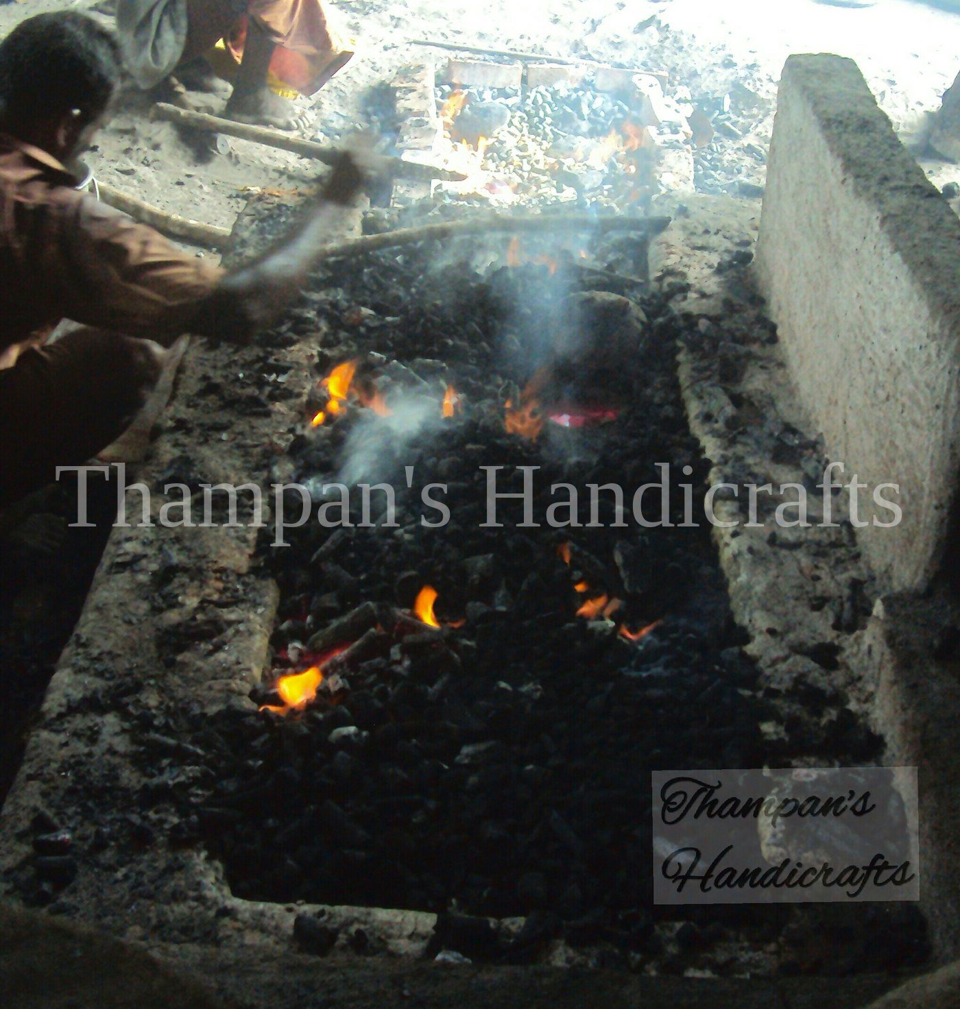 Molten bronze being poured at the Thampan's Handicrafts foundry in Mannar