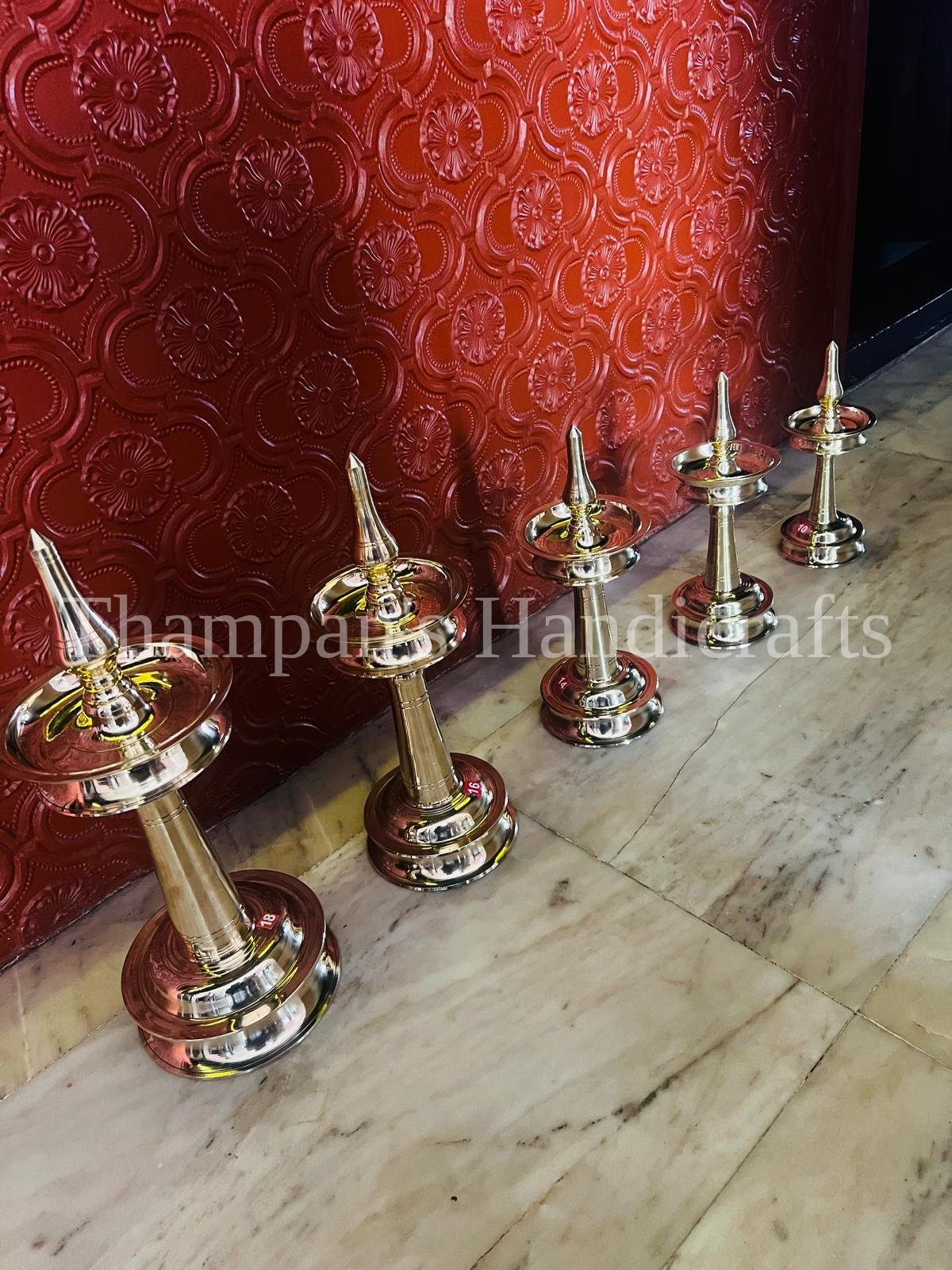 Brass nila vilakku lamps made in Mannar, Kerala